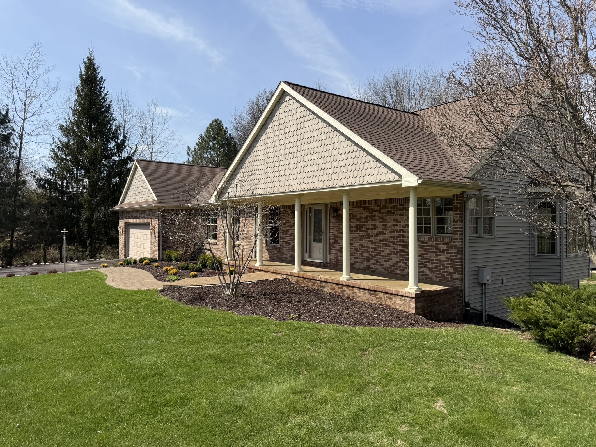 Front exterior of move-in-ready home with brick facade and covered porch