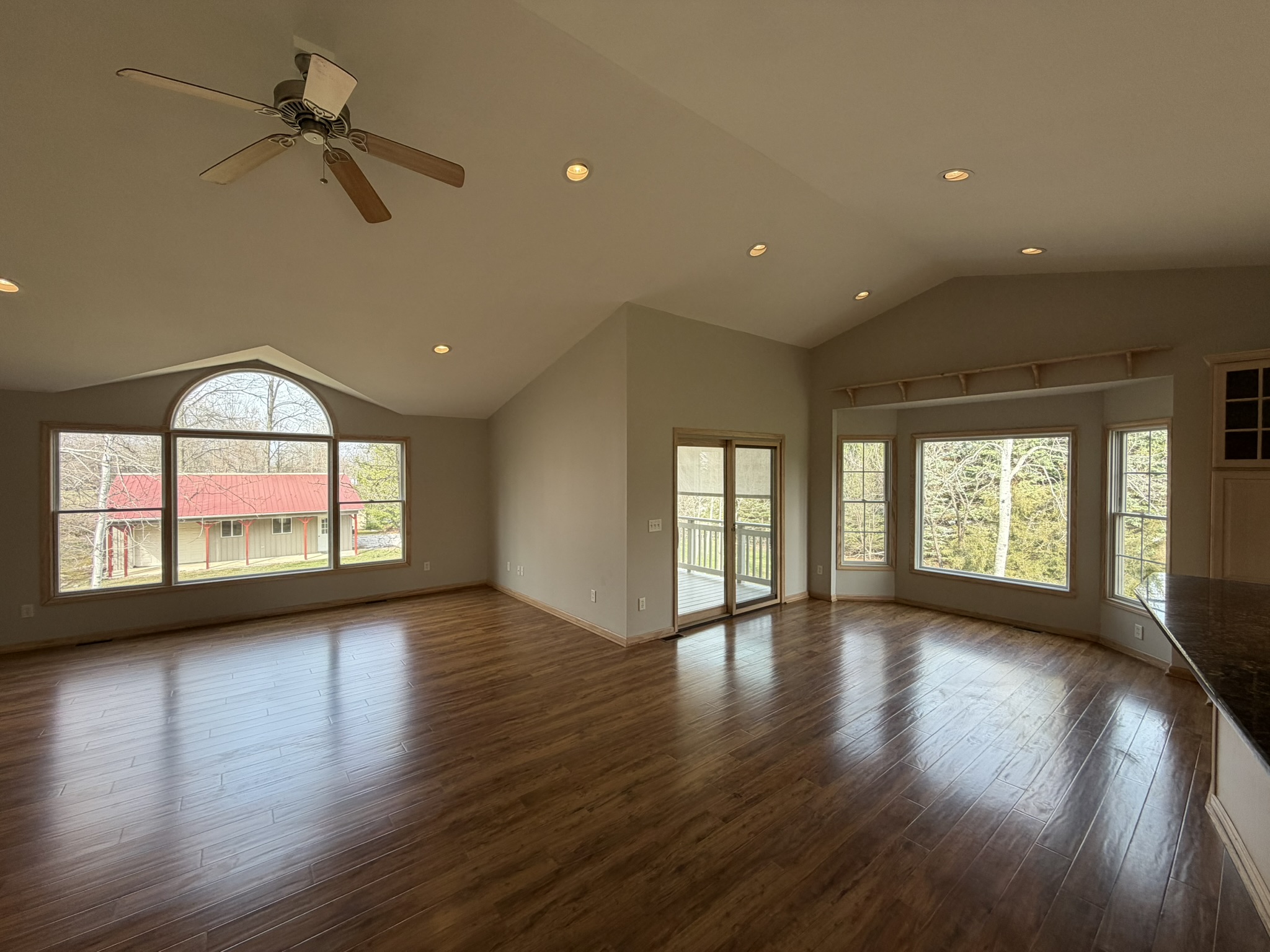 Great room — vaulted ceilings and engineered hardwood floors