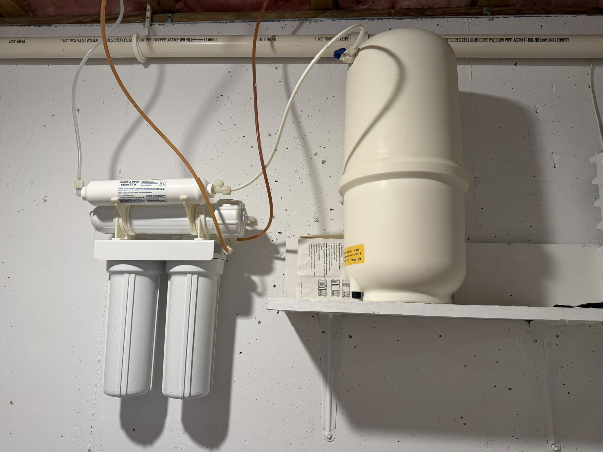 Reverse osmosis drinking water filtration system with storage tank